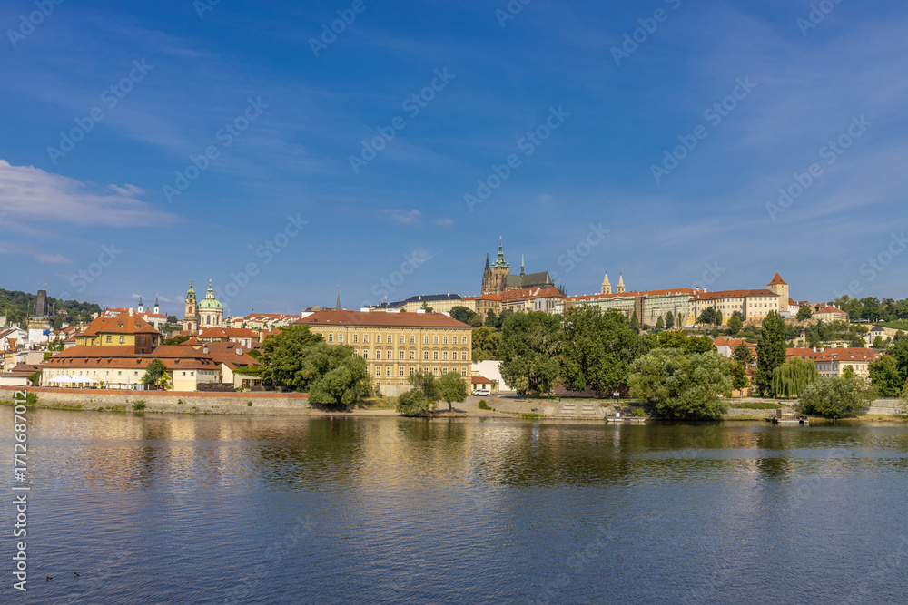 Fototapeta premium Prague cityscape, the capital of Czech Republic tourist sights. Prague historic center district at Charles bridge during the day. Busy tourist area city sights of Prague, capital of Czech