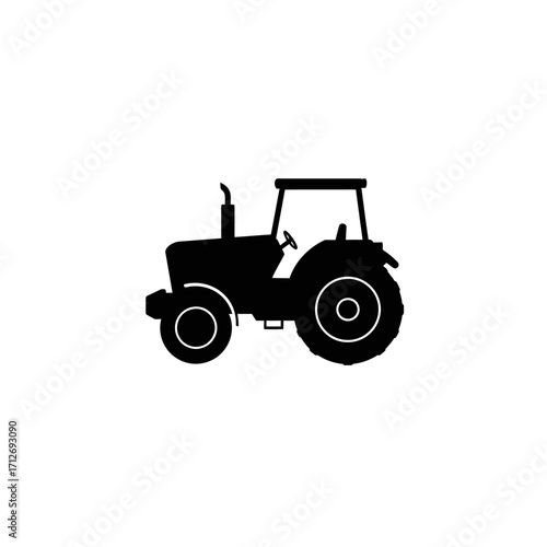 Silhouette of a farm tractor machinery symbol for agriculture and farming isolated on white background