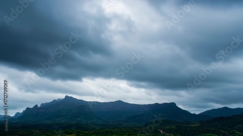 Dramatic mountain landscape under stormy sky with scenic nature background.