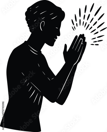 Silhouette of a person praying with light emanating from their hands on white background