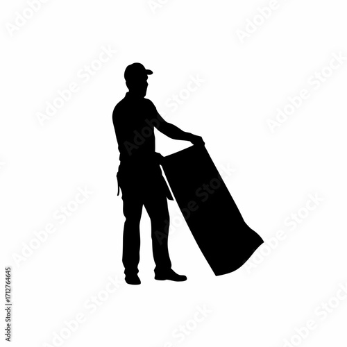 Silhouette of construction worker holding roofing sheet against wind isolated on white background