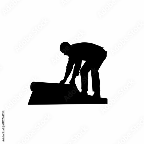 Silhouette of installer laying insulation under roofing sheet isolated on white background
