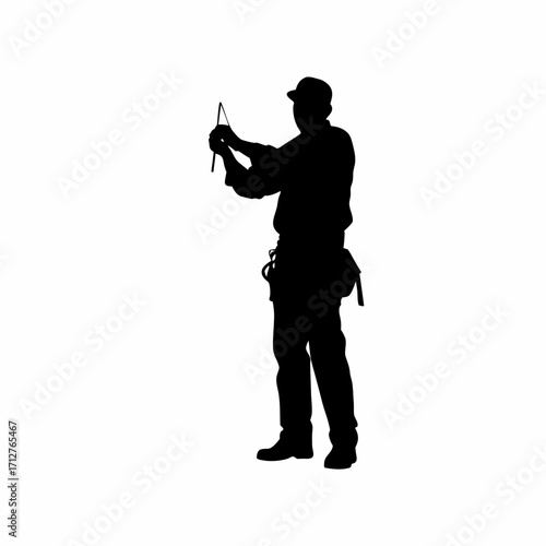 Silhouette of construction worker marking roof lines with chalk isolated on white background
