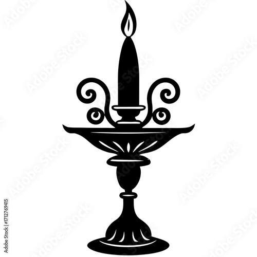 Ornate candle holder with lit candle black silhouette