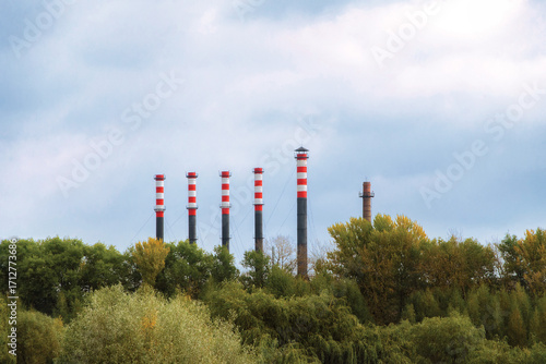 Quadro su tela Pipes of a thermal power plant against the sky, industry
