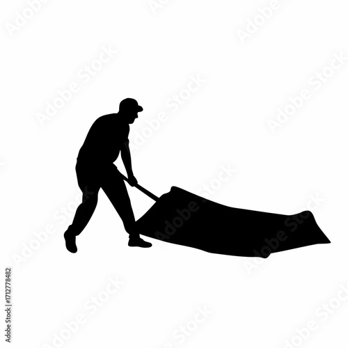 Silhouette of roofing worker dragging heavy sheet uphill roof isolated on white background