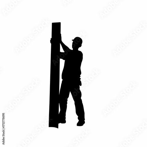 Silhouette of roofing worker guiding sheet into tight corner isolated on white background