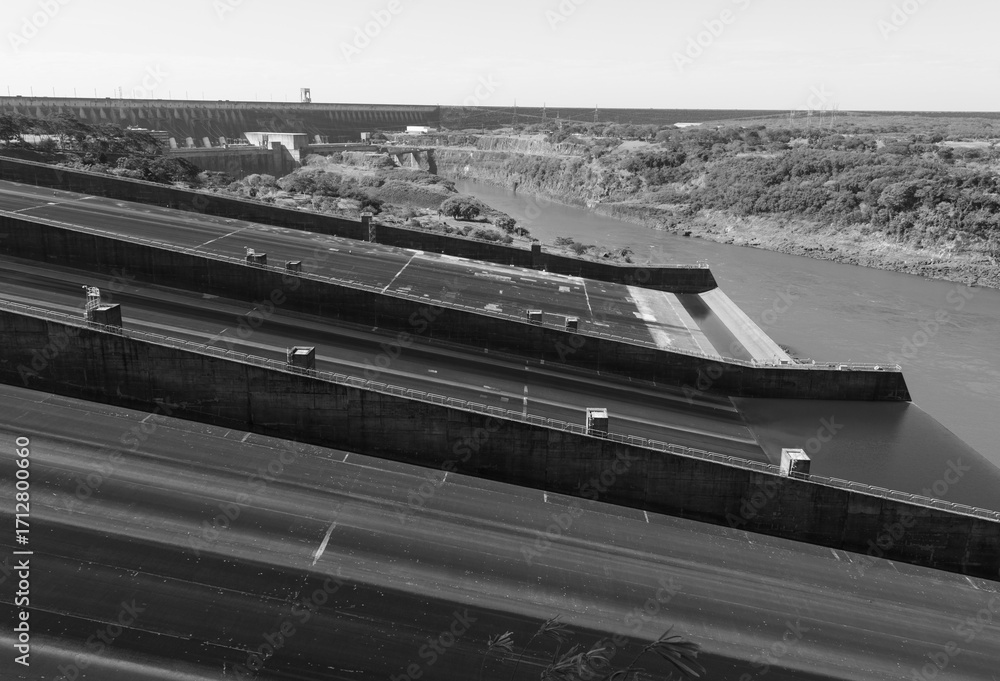 Fototapeta premium Black and white landscape comprising part of the Itaipu Power Plant spillway on the Paraguayan side along the Parana River