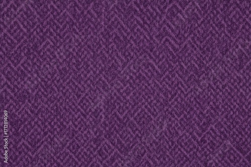 Close-up of woven purple tweed with houndstooth design, woolen textile surface