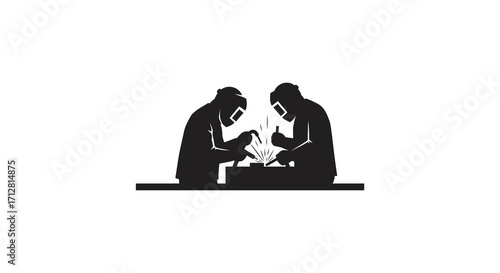 Two welders working intensely with sparks flying a striking silhouette