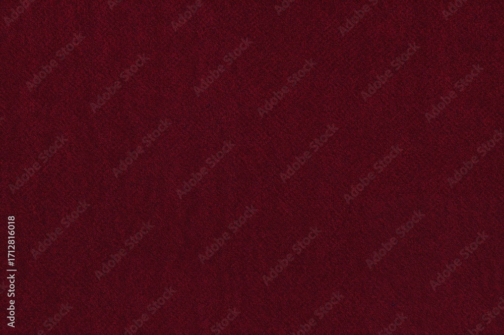 Fototapeta premium Crimson fabric couch with textile backdrop