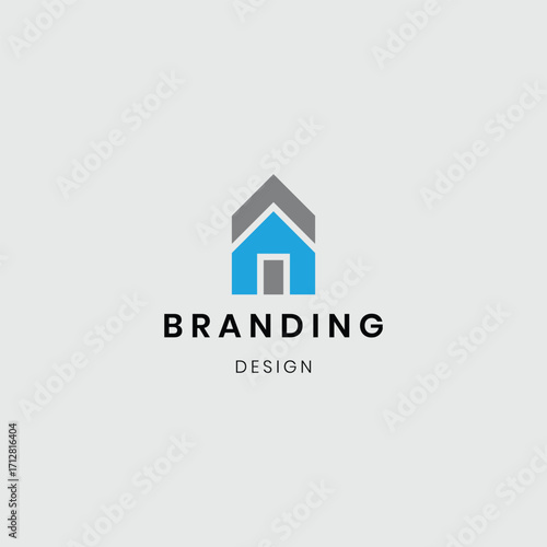 A logo showing a house with buildings, symbolizing real estate, construction, and property development. Suitable for architecture firms, real estate agencies, home builders, and construction businesse