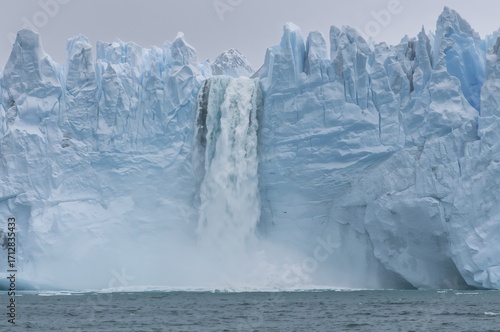 Wallpaper Mural Waterfall from melting glacier ice plunges into ocean amid climate emergency in the Arctic Torontodigital.ca