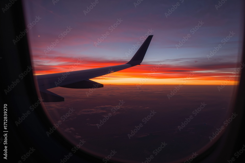 Fototapeta premium Witness the serene charm of a stunning sunset painted in vivid colors, creating a calming and inspiring atmosphere.