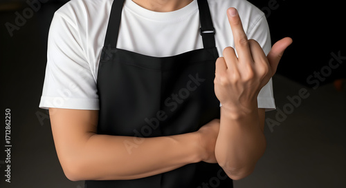 Chef or server expressing dissatisfaction with defiant middle finger gesture, perfect for edgy marketing or rebellious brand messaging and satire