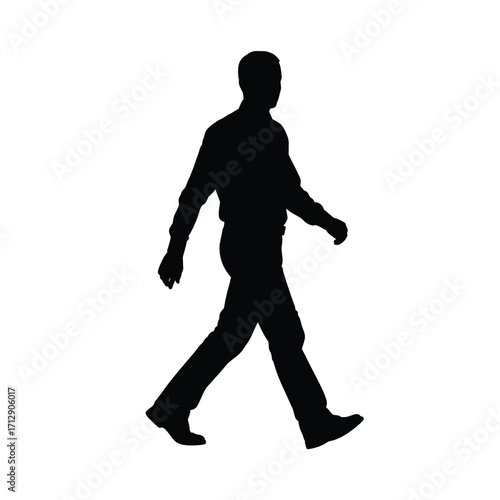 A solitary figure walking forward captured as a striking silhouette