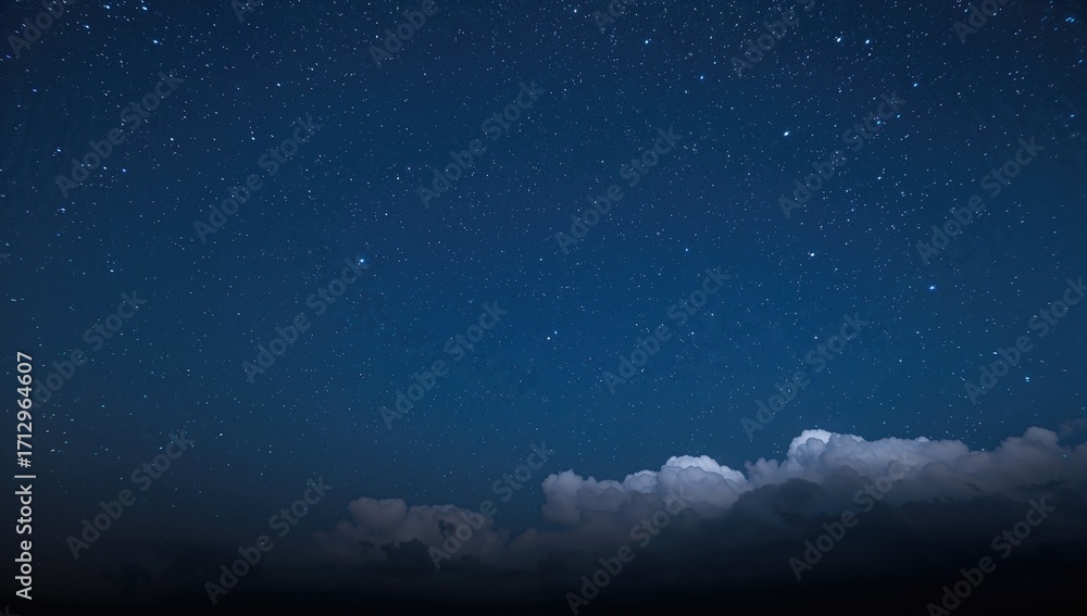 Fototapeta premium Night sky filled with stars and clouds