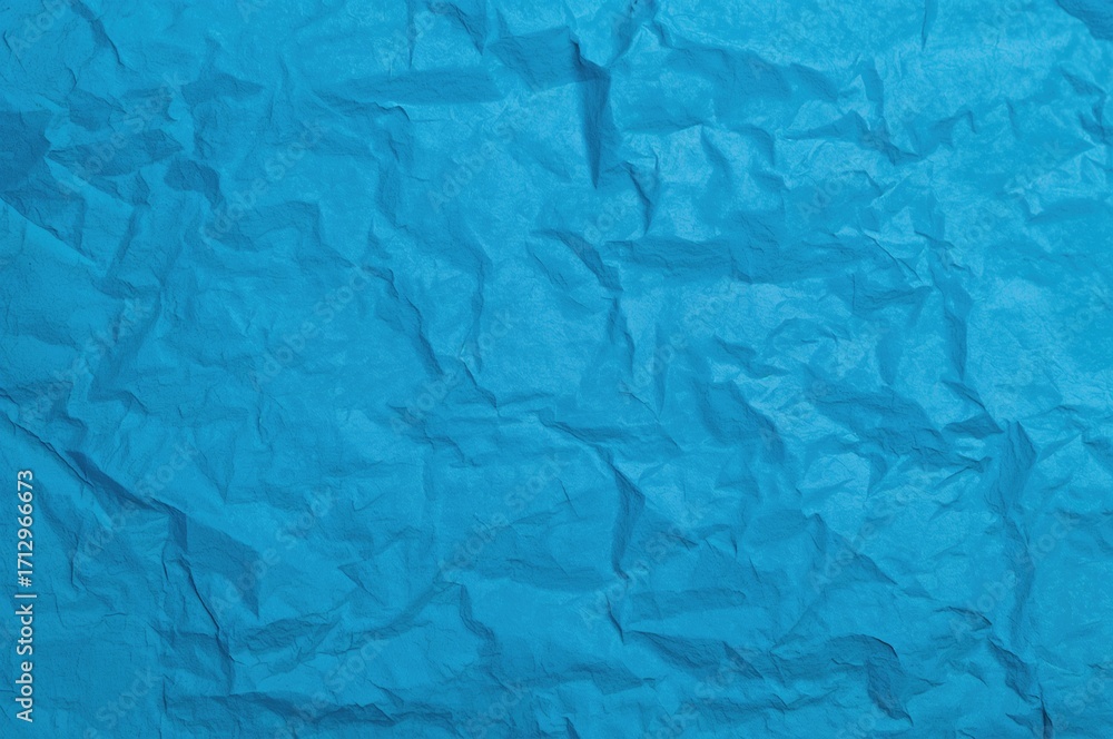 Obraz premium Wrinkled blue paper texture backdrop