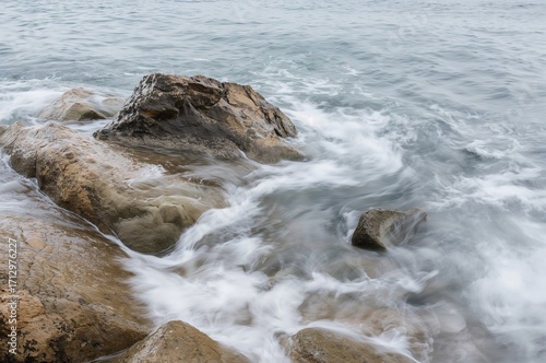 The Sea Crashes Over Stones...