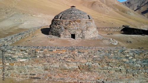 Aerial drone view of the ancient Tash Rabat caravanserai, built in the 15th century. Located in the mountains of the Tien Shan at an altitude of over 3500 m above sea level.