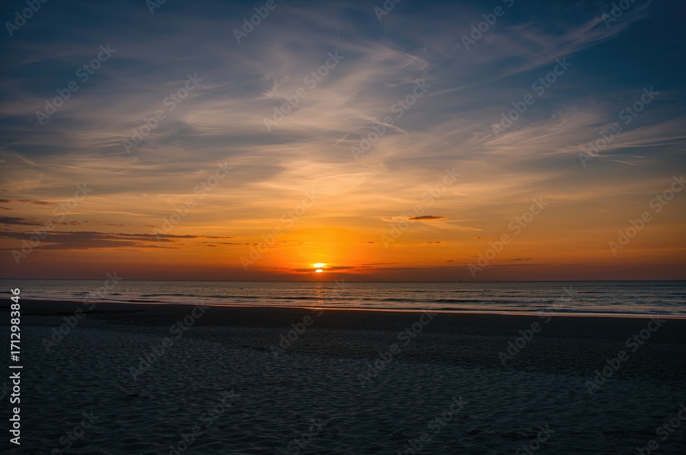 Fototapeta premium Beautiful blue sky during sunrise and sunset over a scenic beach landscape