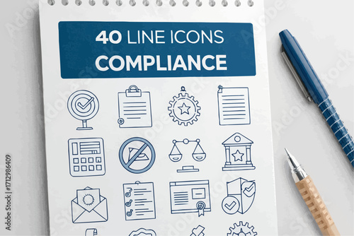 Close up of a notepad with compliance icons and two pens on a white surface in a well lit environment