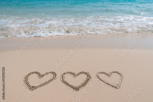 Three heart shapes sketched...