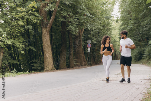 Couple running in a park enjoying their workout together