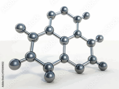 Molecular structure model with silver spheres and connecting rods on a white surface in a studio shot
