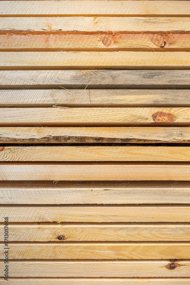 Obraz premium Natural surface of stacked wood timbers. Vertical view