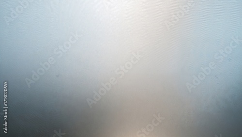 Vertical shot of an office space featuring frosted glass with fine line patterns