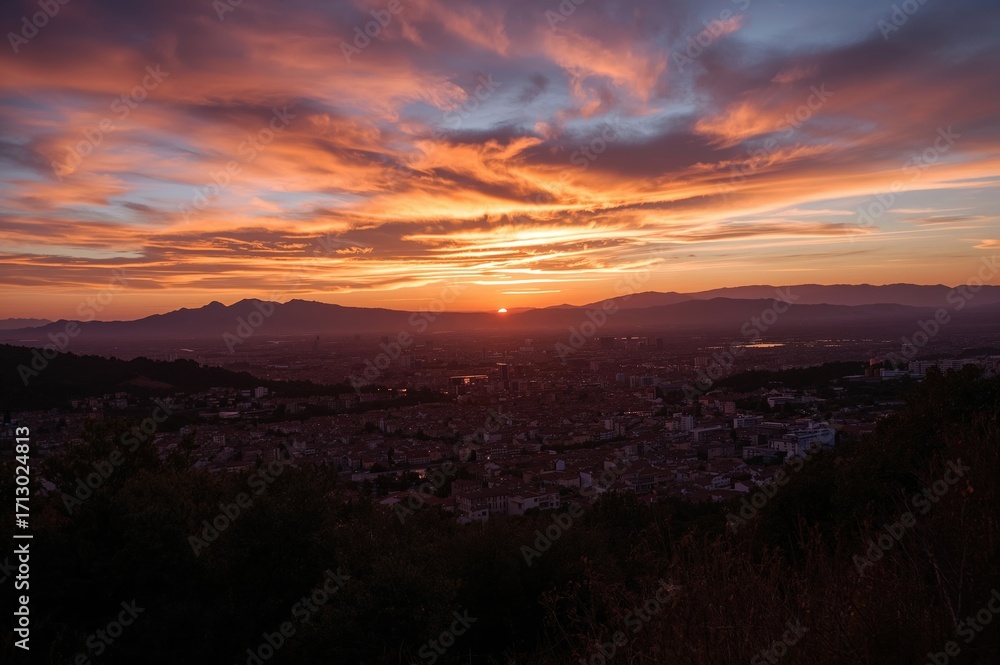 Fototapeta premium Sunset view of a town skyline in silhouette