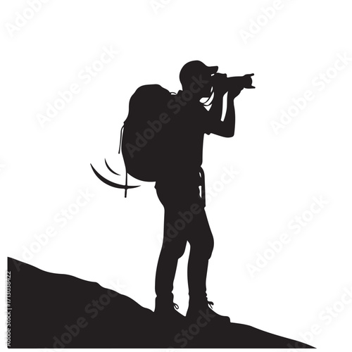 Black Silhouette of an Outdoor Photographer with Backpack and Camera on a Hiking Trail