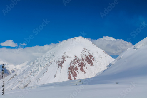 Картината върху платно Snow-covered mountains around Lenin Peak or Ibn Sina Avicenna Peak, high-altitud