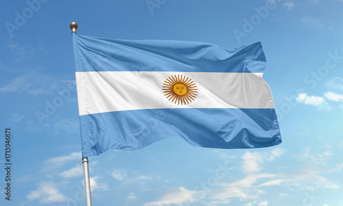 Argentinian national flag waving in the sky with sun of may symbolizing freedom and independence of Argentina