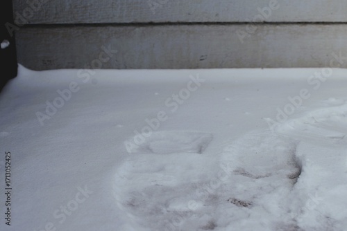 Melted Footprints in Snow by Exterior Wall