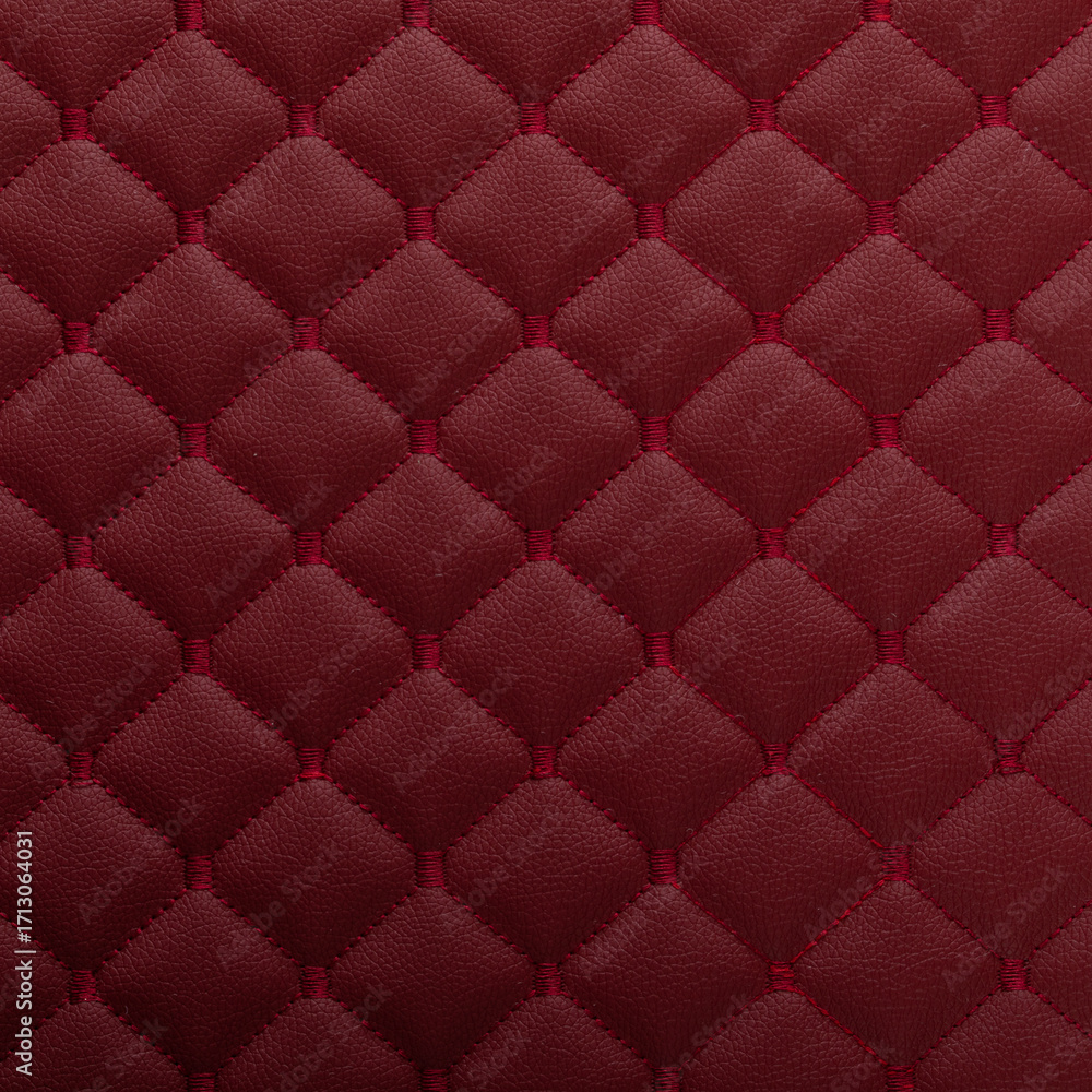 Fototapeta premium Red leather texture with diamond-shaped ornament
