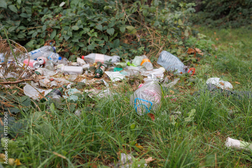 Garbage and plastic litter polluting forest and nature environment