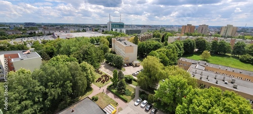 A breathtaking aerial view showcasing a beautiful urban green space amidst modern buildings