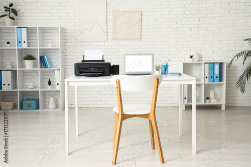 Stylish workplace with mode...
