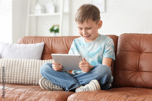 Cute little boy with modern...