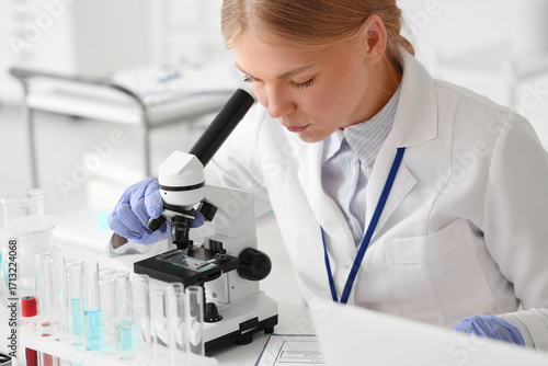 Female scientist looking th...