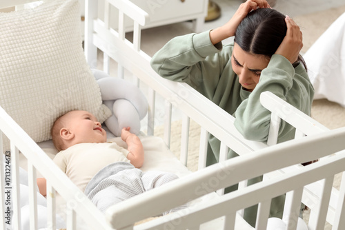 Young mother suffering from...