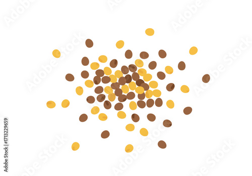 A scattering of brown and yellow candies mostly clustered in the center of the image
