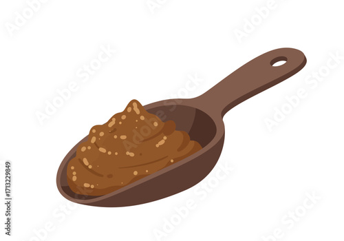 A wooden spoon overflowing with brown textured spread possibly mustard