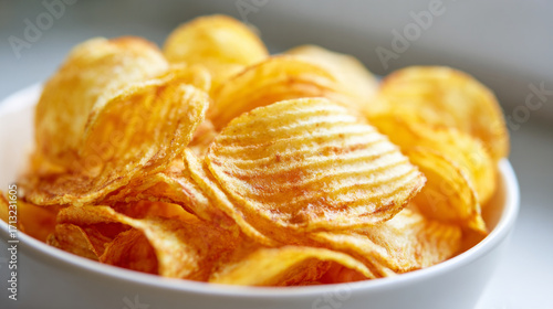 Crispy Potato Chips in a White Bowl