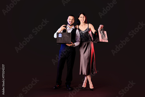 Young couple with shopping ...