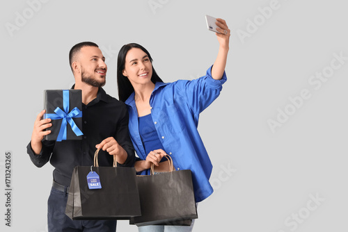 Young couple with gift and ...