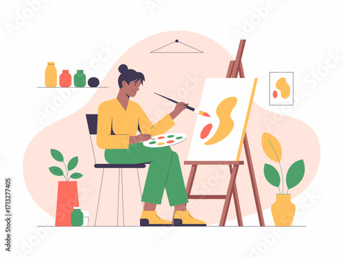 Artist creating vibrant masterpiece on canvas in bright, modern studio space, full of inspiration