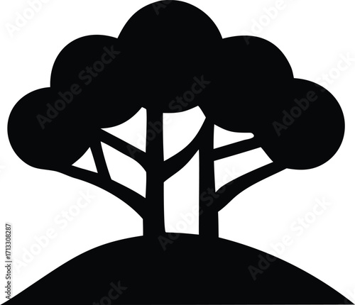 Bold silhouette of a majestic tree with lush canopy standing proudly on a rounded hilltop natural landscape element